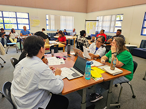 People listening to a presentation in a classroom