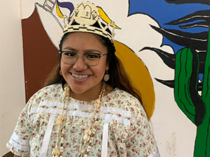 Smiling female student in cultural attire